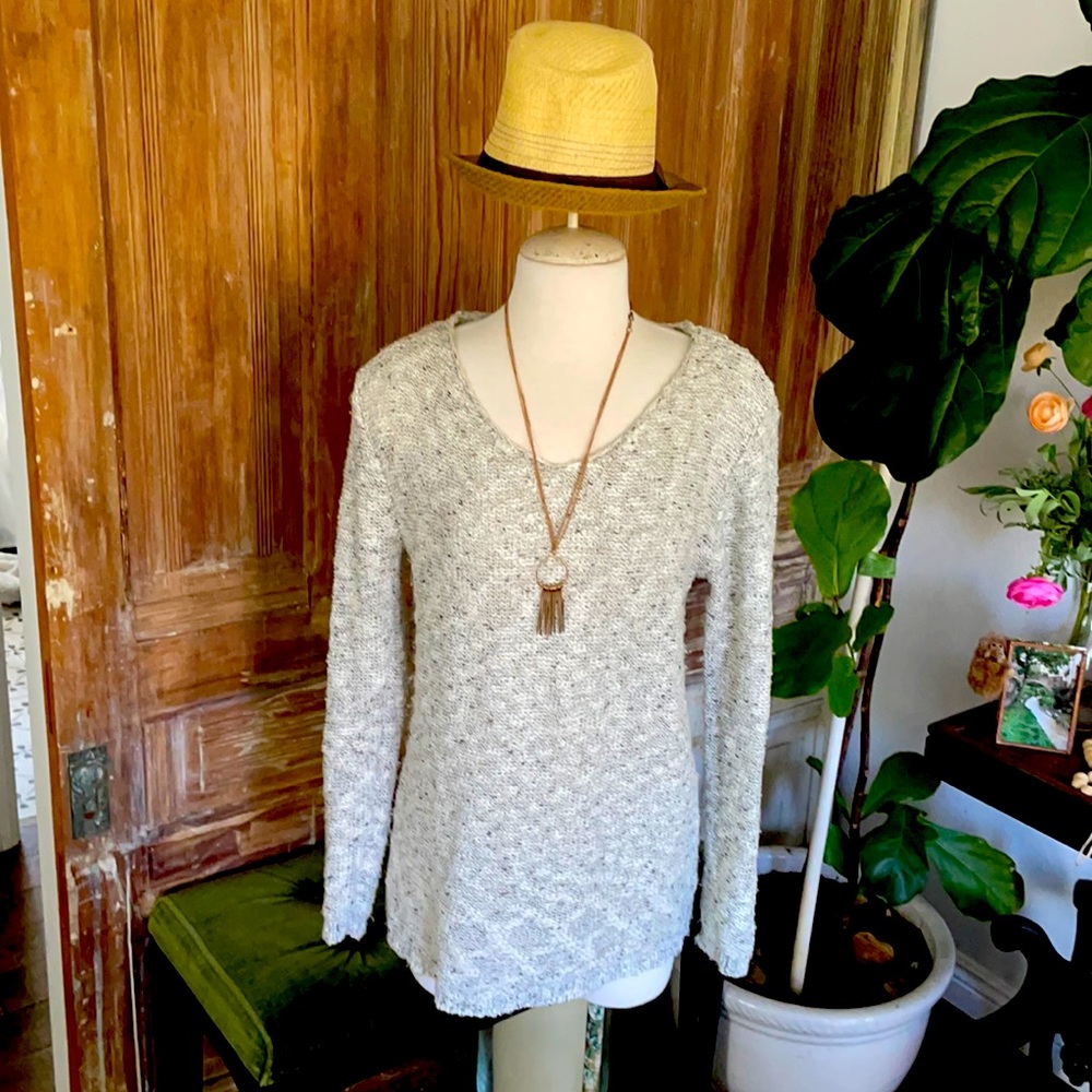 Long, V neck sweater.